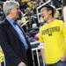 Michigan Governor Rick Snyder chats with a Michigan fan during half time at Crisler Center on Tuesday. Melanie Maxwell I AnnArbor.com